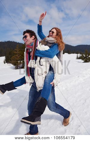romantic winter  scene, happy young couple having fun on fresh show on winter vacatio, mountain nature landscape