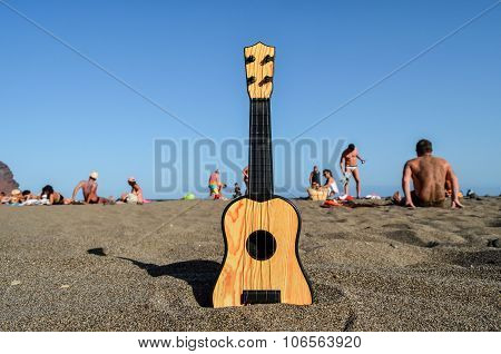 Guitar on the Sand Beach