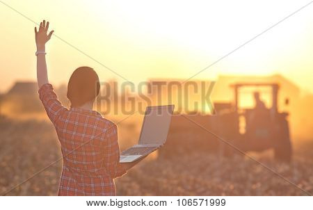 Woman With Laptop And Tractor