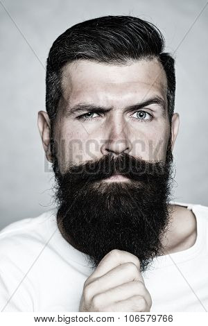 Grey-haired Man Pulling Beard
