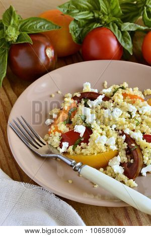 Millet with basil, tomatoes and goat cheese