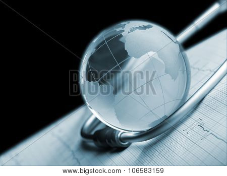 Globe And Stethoscope On Ecg Concept