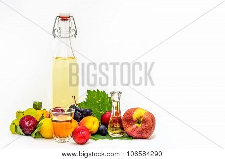 A Bottle Of Home Made Brandy With Autumn Fruit