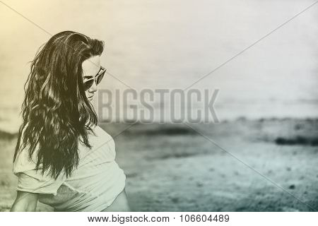 Long Hair Girl Relaxing On The Beach