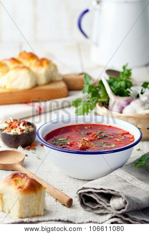 Traditional Ukrainian Russian vegetable soup, borsch with garlic donuts, pampushki.