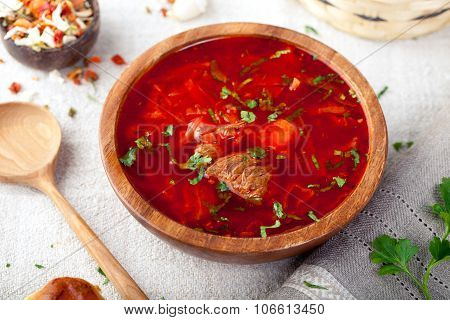 Traditional Ukrainian Russian vegetable soup, borsch with garlic donuts, pampushki .