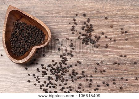 Milled Black Pepper ,black Pepper Corns On An Old Wooden Background