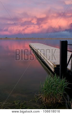 Fishing Dock with a pink cloud sunset