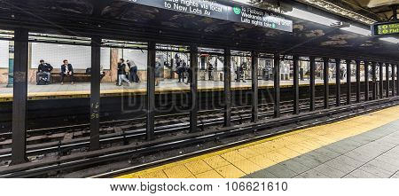 People Wait At Subway Station Wall Street