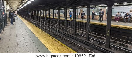 People Wait At Subway Station Wall Street