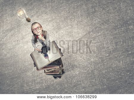 Wideangle picture of funny schoolgirl with paper plane in hand