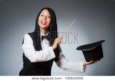 Woman magician in funny concept