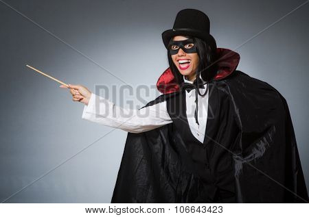 Woman magician in funny concept