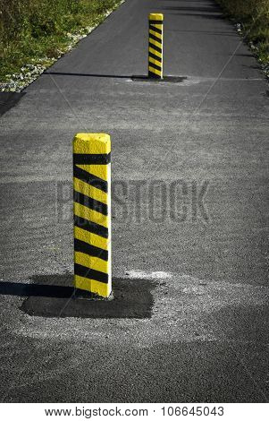 Warning Concrete Pillars On The Road