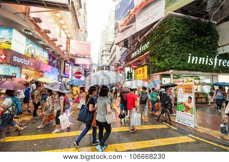 Many People In Mongkok Street In Rainy Day