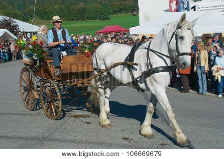 People ride traditional horse carriage at the annual Cheese Festival in Affoltern Im Emmental.