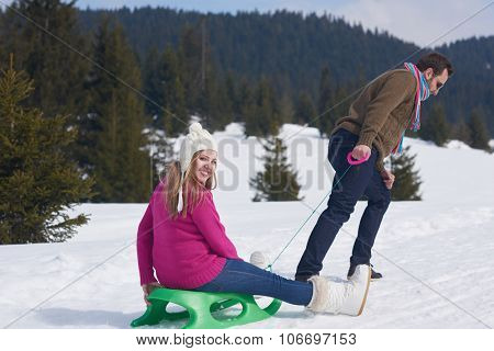 romantic winter  scene, happy young couple having fun on fresh show on winter vacatio, mountain nature landscape