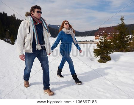 romantic winter  scene, happy young couple having fun on fresh show on winter vacatio, mountain nature landscape