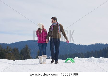 romantic winter  scene, happy young couple having fun on fresh show on winter vacatio, mountain nature landscape