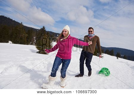 romantic winter  scene, happy young couple having fun on fresh show on winter vacatio, mountain nature landscape