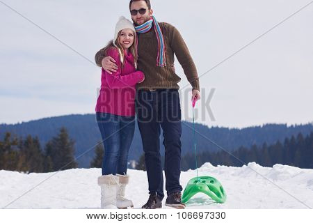 romantic winter  scene, happy young couple having fun on fresh show on winter vacatio, mountain nature landscape