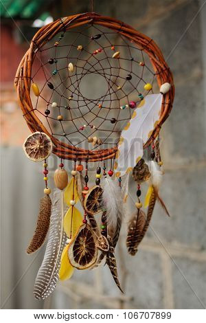 Handmade Dream Catcher At Wall In Background
