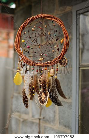 Handmade Dream Catcher At Wall In Background