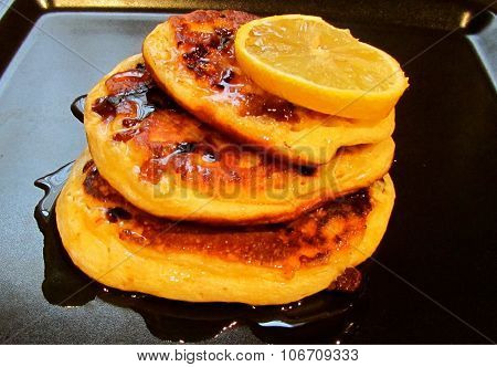 American pancakes with syrup and lemon