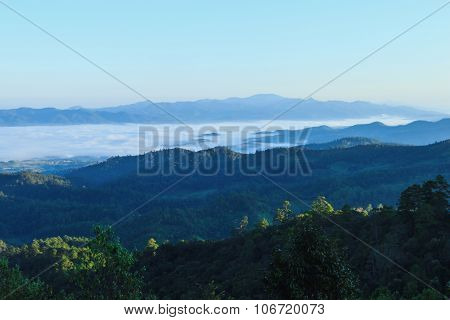 Misty morning sunrise in mountain in Wiang Haeng ,Chiang Mai , Thailand.