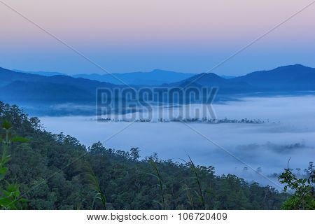 Misty morning sunrise in mountain in Wiang Haeng ,Chiang Mai , Thailand.