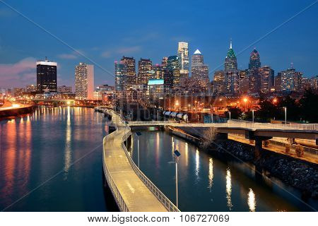 Philadelphia skyline at night with urban architecture.