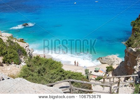 Blue Beach With Some People Seen From The Top. Cala Goloritze In Summertime