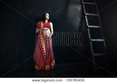 The pregnant woman with henna tattoo