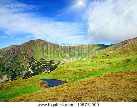 Summer Mountain View With Small Puddle