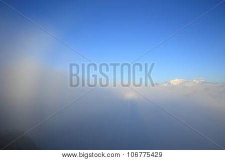 beautiful rolling clouds and sunrise on mountain peak landscape