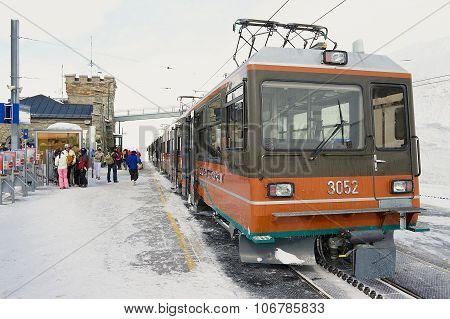 People stand at the upper Gornergratbahn railway station in Zermatt, Switzerland.