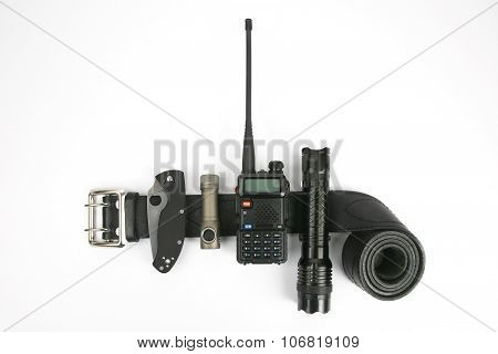 Folding Knife, Radio Transmitter A Flashlight And A Taser On A Black Leather Strapthe