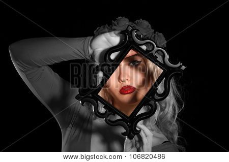 Pretty Young Woman Holding A Frame In Front Of Her Face
