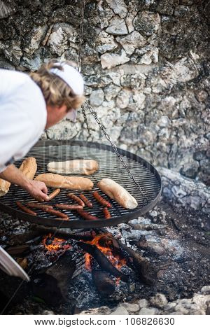 Person Preparing Hot Dogs