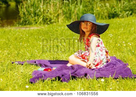 Cute Little Girl In Big Hat Pretending To Be Lady
