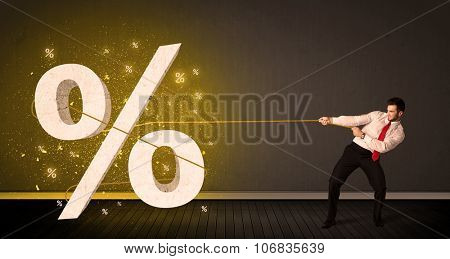 Business man pulling rope with big procent symbol sign concept on background