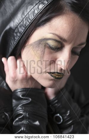 A gothic woman over a dark background,