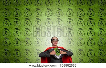 Young woman acting like super hero with euro sign on chest