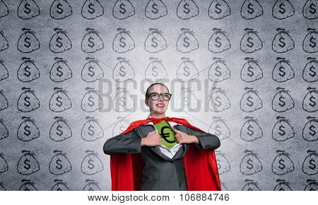 Young woman acting like super hero with euro sign on chest