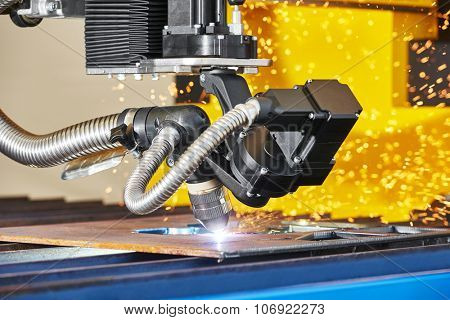 metal working. Plasma or Laser cutting technology of flat sheet metal steel material with sparks