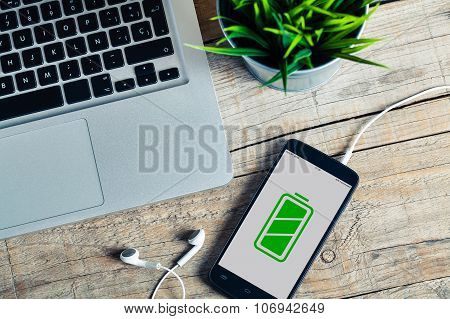 Full Battery Mobile Phone In A Desktop.