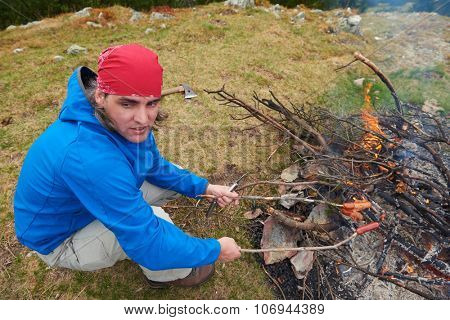 advanture man with backpack hiking on mountain forest