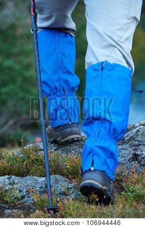 advanture man with backpack hiking on mountain forest