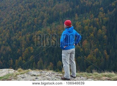advanture man with backpack hiking on mountain forest