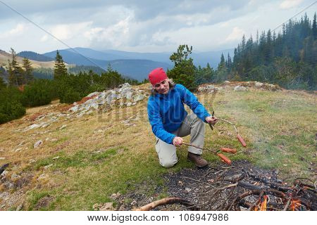 advanture man with backpack hiking on mountain forest